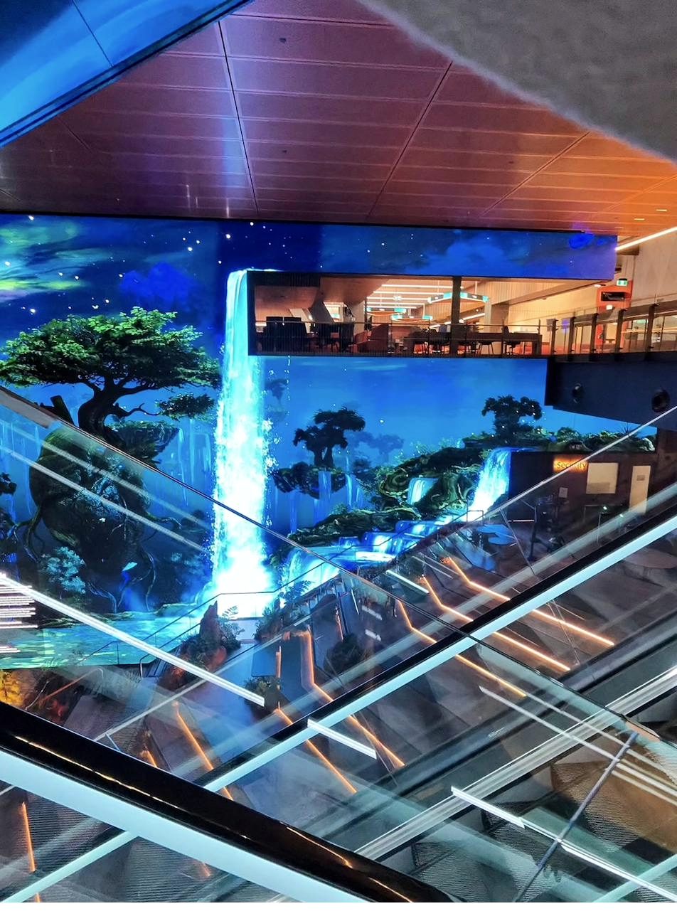 Immersive digital wall above the escalators at ECU City Campus